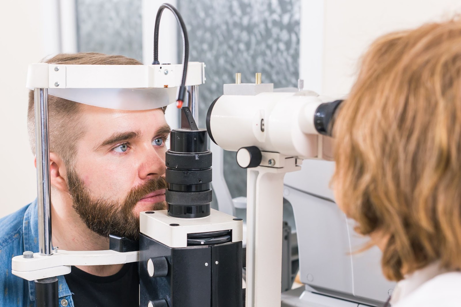 Patient getting their vision tested by an ophthalmologist.