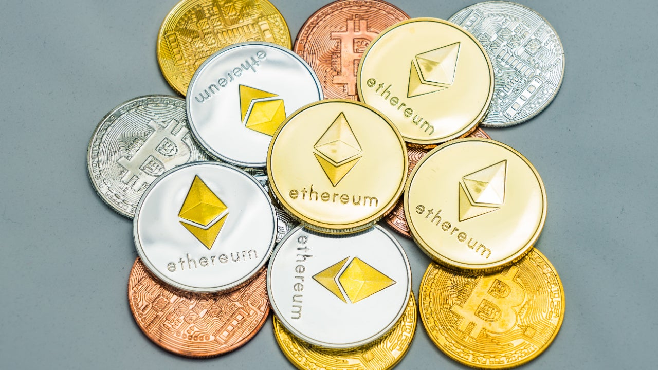 cryptocurrencies on display on a grey background