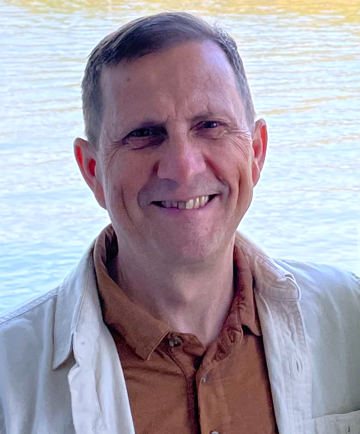 A person smiling at the camera AI-generated content may be incorrect.