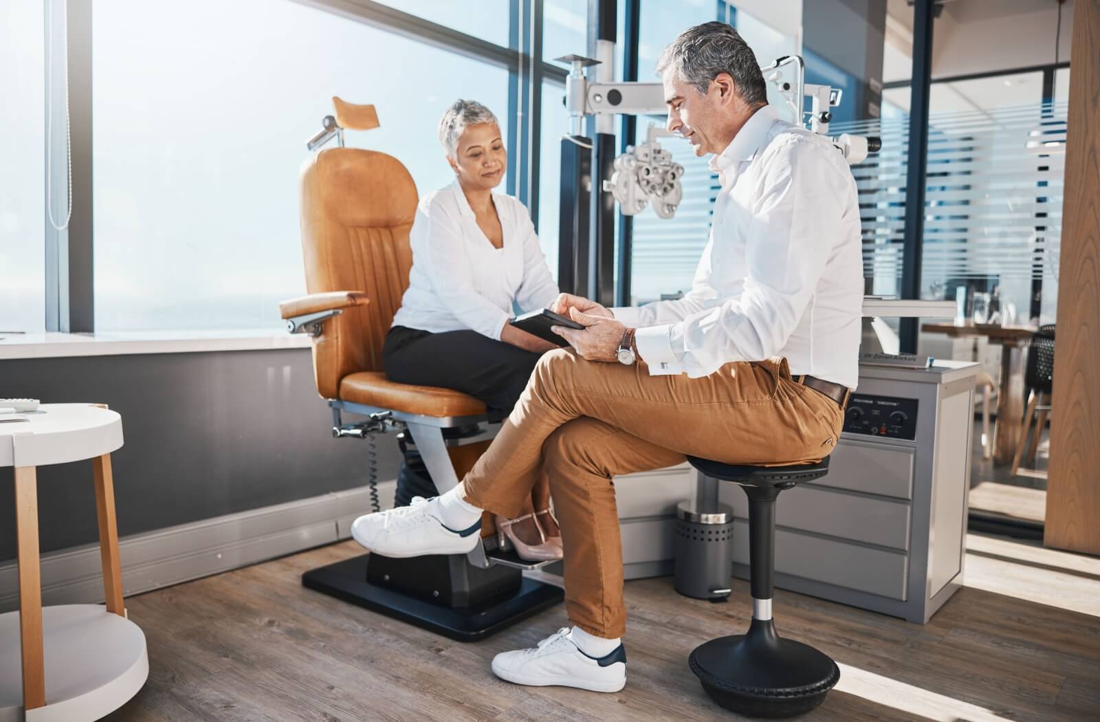 A patient discussing vision therapy treatments with her optometrist