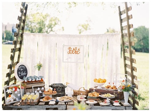 Table decorated in a French theme for a baby shower