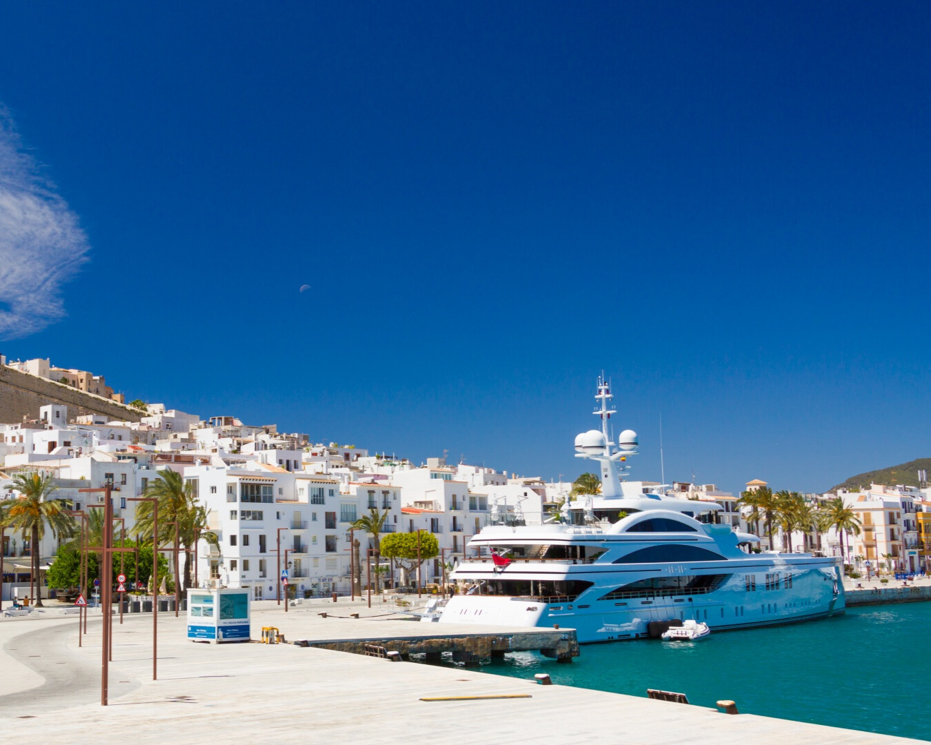 Ship on water with buildings in the background.