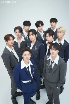 This contain THE BOYZ standing next to each other in front of a white background