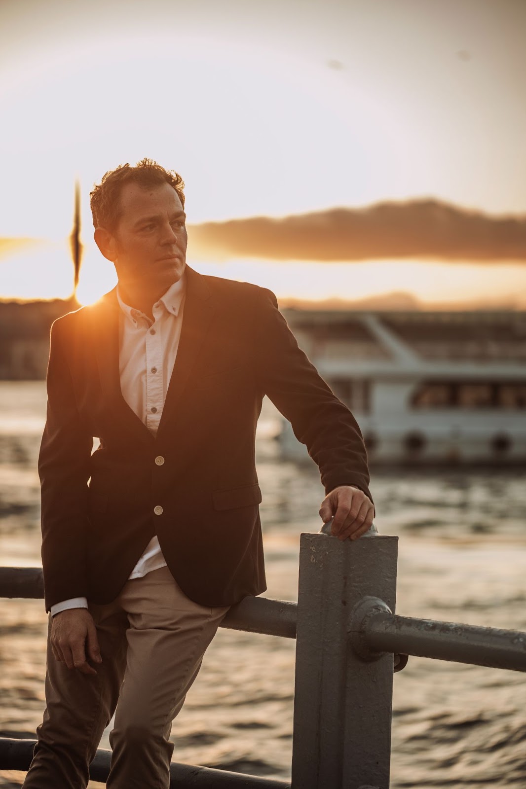 Golden hour by the sea. Sharp style, ferry in the glow.