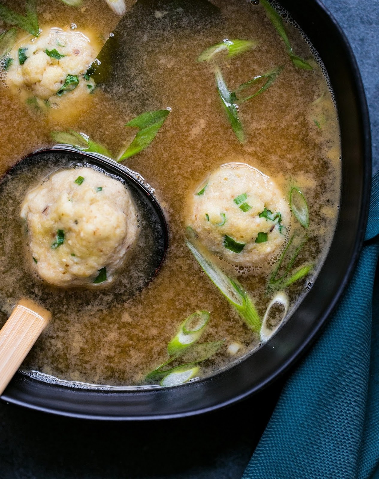 passover recipes: close-up of miso matzoh ball soup in a bowl