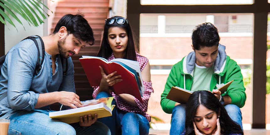 Four students are sitting outdoors, appear to be preparing for the NATA (National Aptitude Test in Architecture) together in a casual setting.