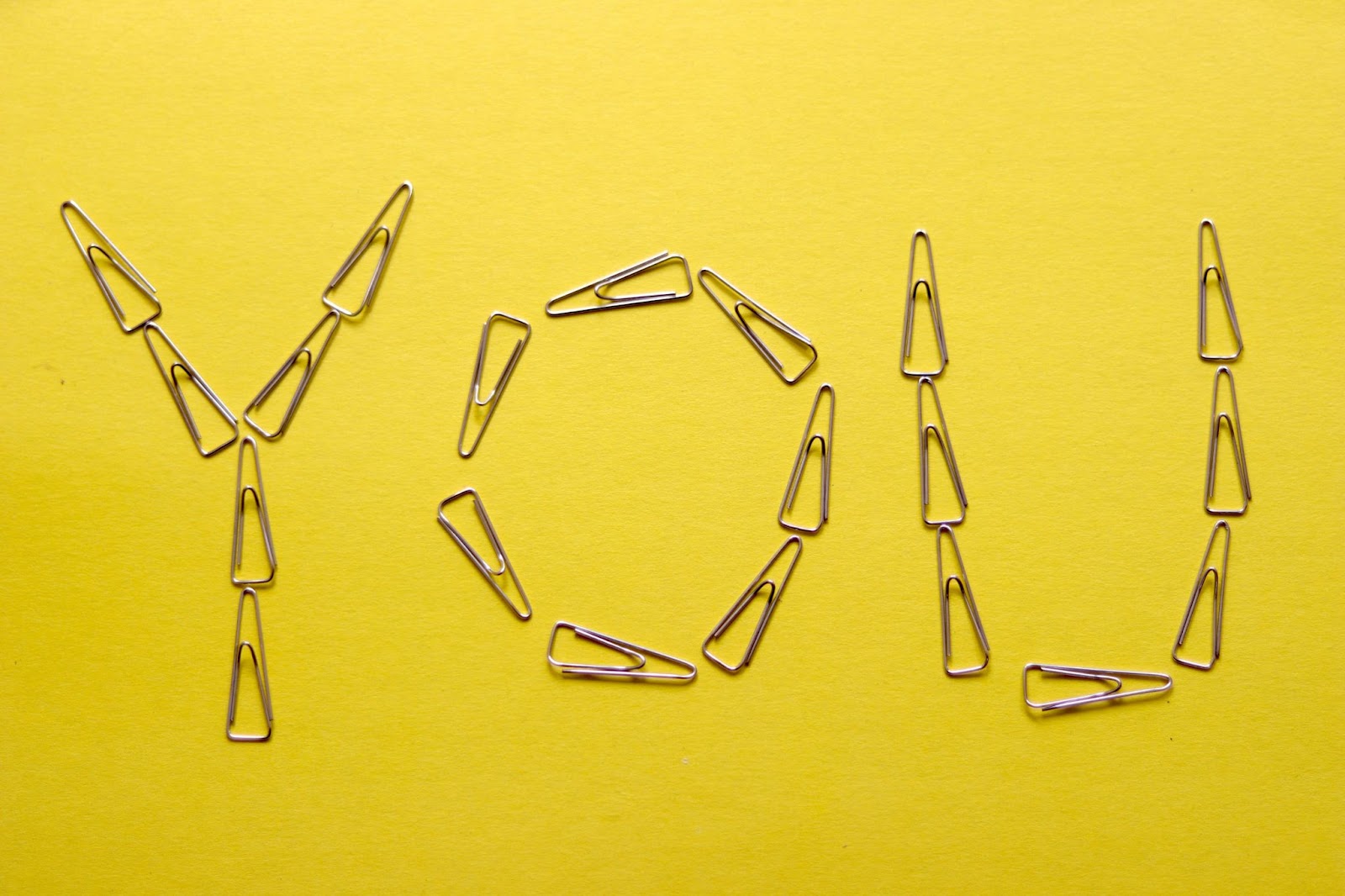 chart your self-improvement journey. photo of the word "you" spelled out in paperclips