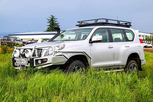Toyota Land Cruiser Prado 150 Novyy Urengoy, Russia - June 25, 2016: Motor car Toyota Land Cruiser Prado 150 is parked at the countryside. Rhino-Rack Vortex 1500 Roof Rack stock pictures, royalty-free photos & images