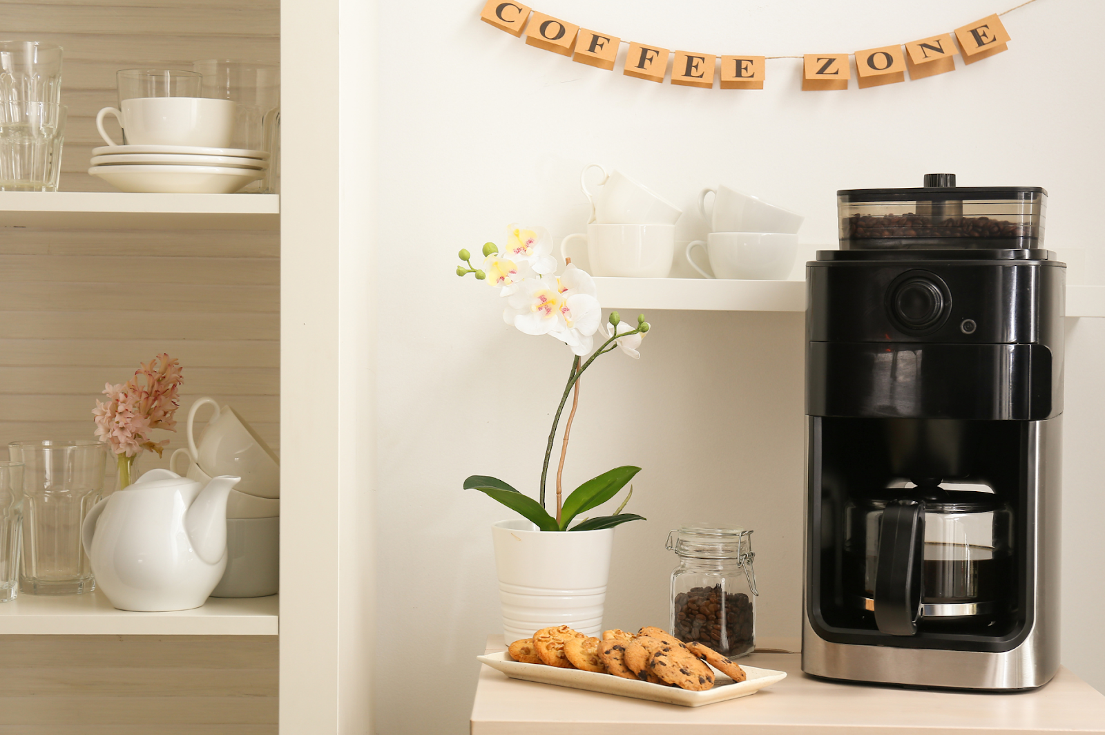 A picture of a cozy coffee zone with coffee machine and cookies