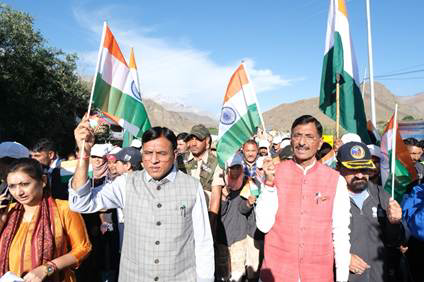 A group of people holding flagsDescription automatically generated