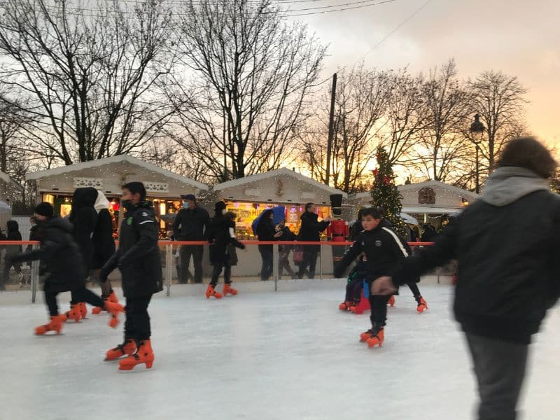 Ice skating in Paris: Tuileries Garden Christmas Market Rink at sunset