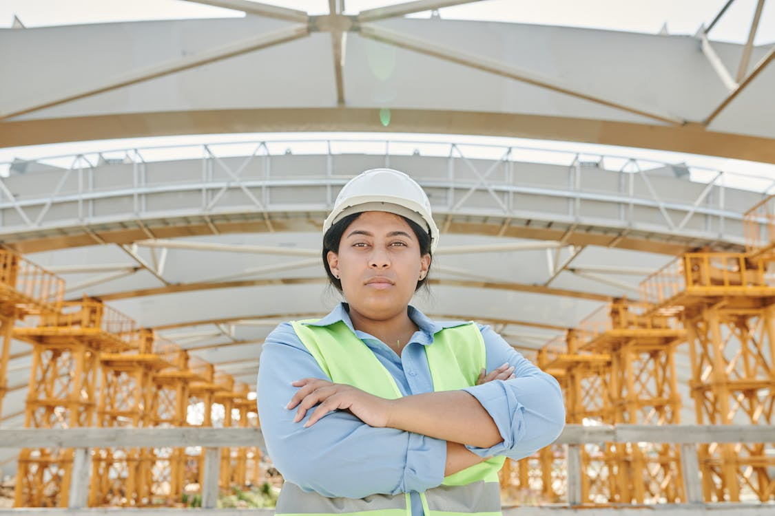 Confident construction supervisor on site representing automated incident management practices.