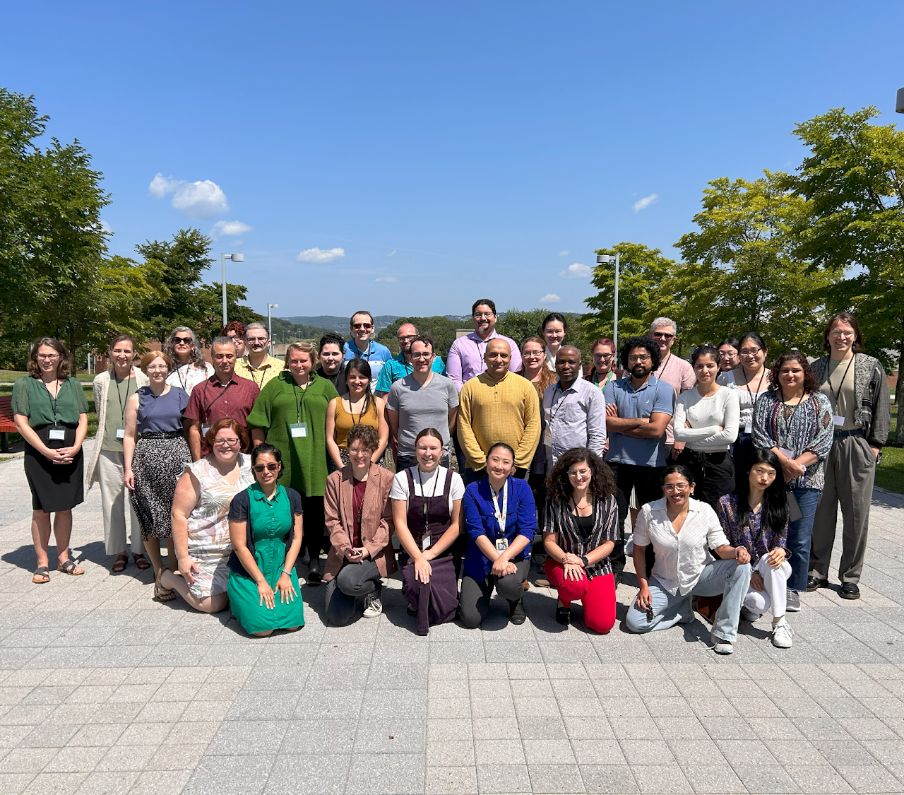 The 2023 DHRI cohort poses for a group photo in front of the fountain outside Bartle Library.