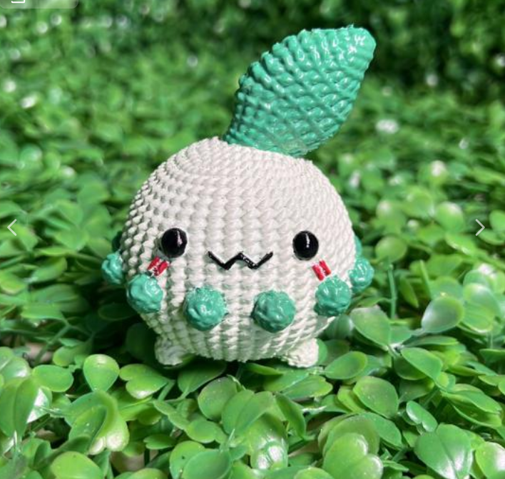 Chikorita-inspired crochet-style 3D printed keychain and piggy bank with leaf on head, designed by Whale 3D Studio

