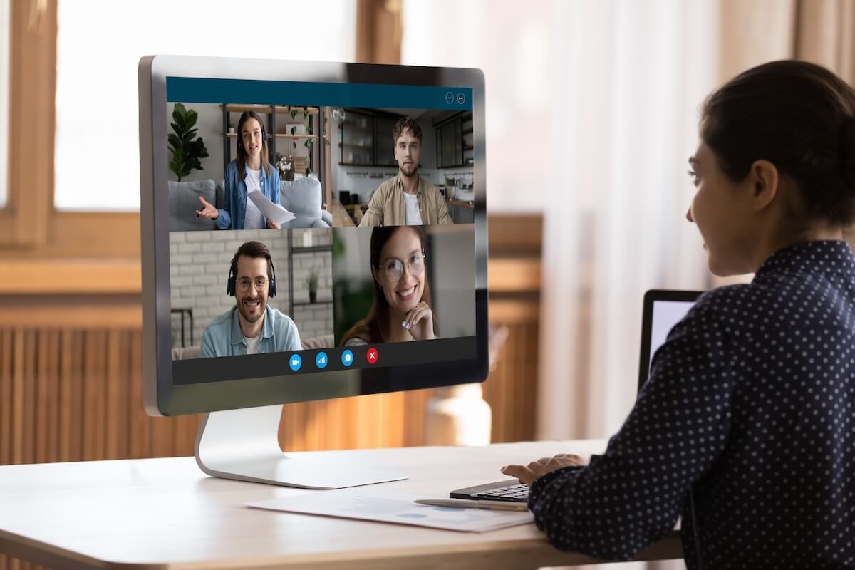 Leave and attendance management system: HR staff having a video call with her team