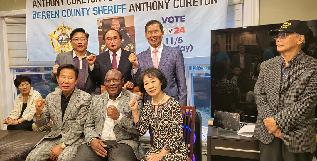 A group of people posing for a photo

Description automatically generated