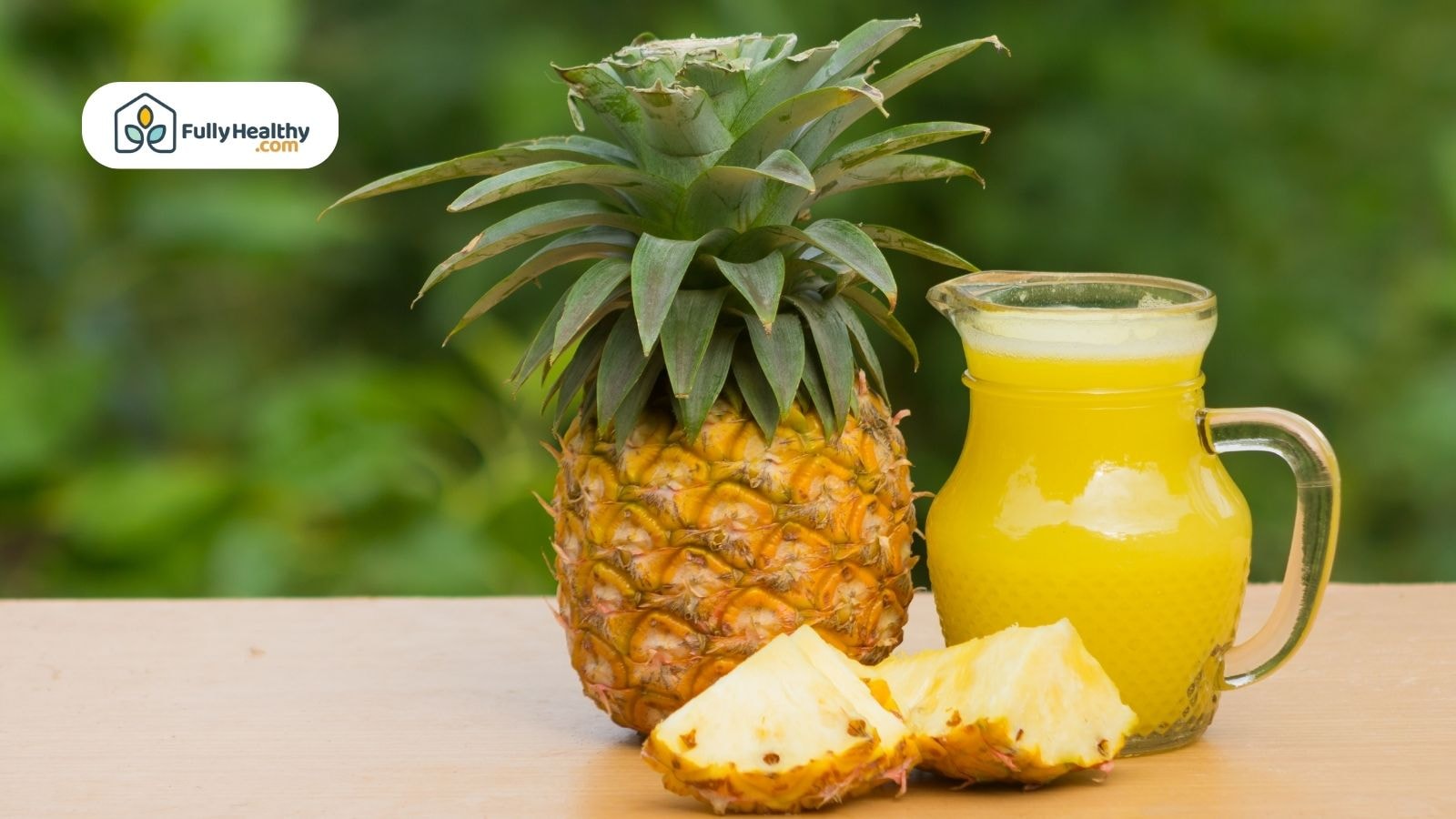 Fresh pineapple and juice on table with green background