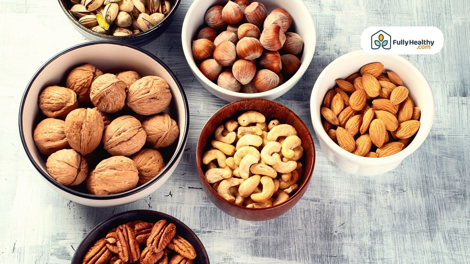 Assorted nuts in different bowls