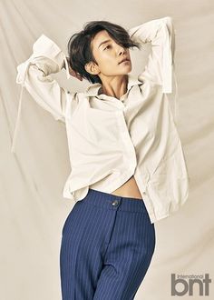 Actress Kim Seo-hyung, wearing a white shirt and a navy blue strip trouser 