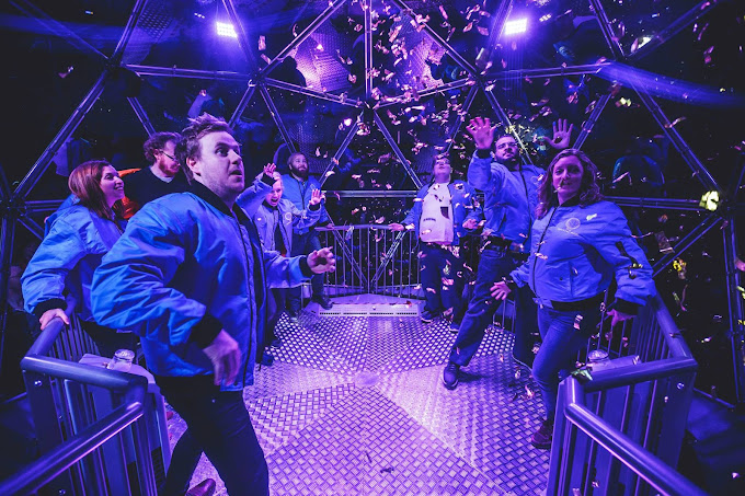 Participants enjoying the thrilling challenges at The Crystal Maze Experience in London, testing their skills in a unique and interactive environment