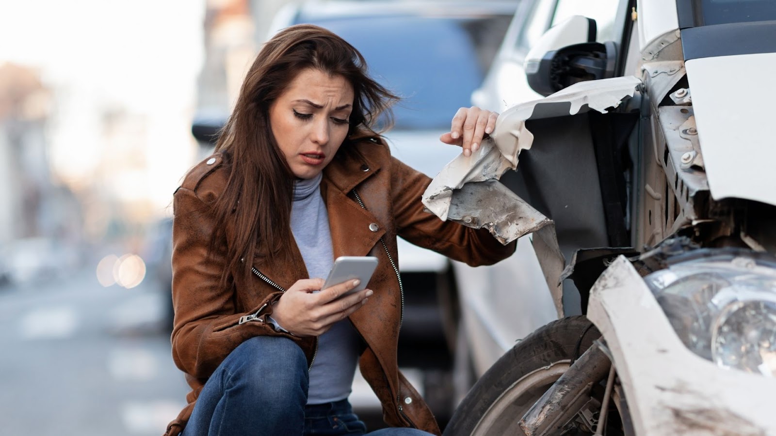 woman calling for help after a car accident