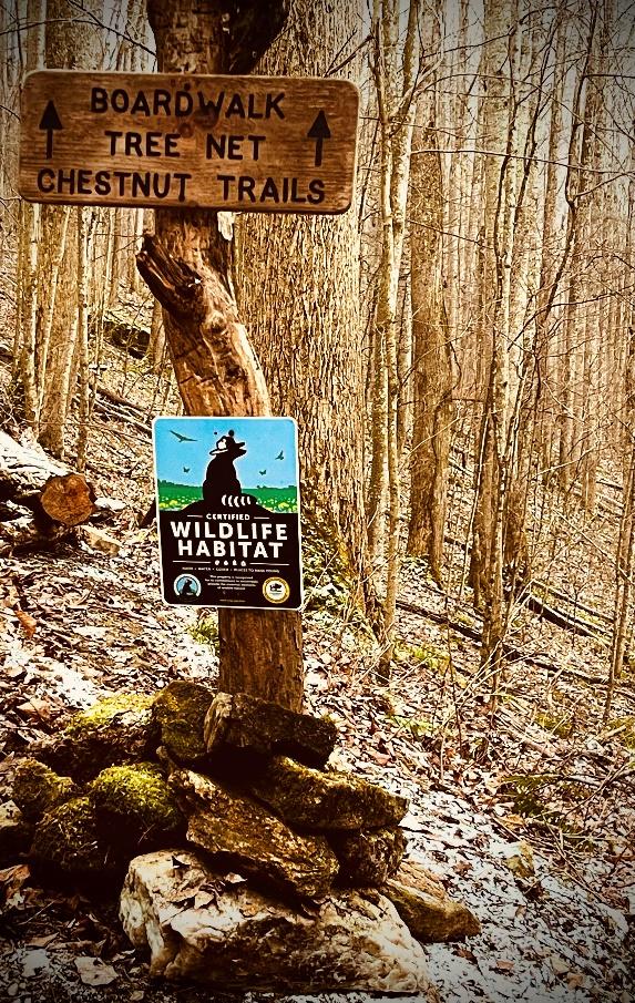 Certified Wildlife Habitat sign at trail head in The Retreats at Spring Creek Preserve.
