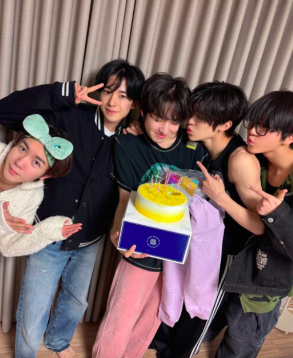 This contains an image of NCT WISH's Sakuya and  NCT WISH members during his birthday