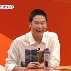 A picture of  Shin Dong Yup laughing