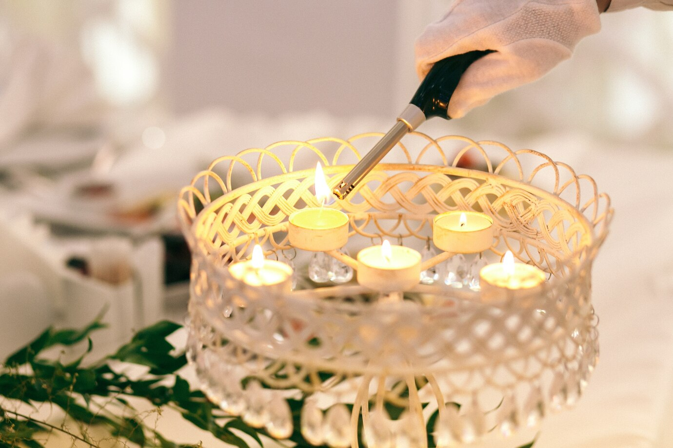 DIY floating candle wedding centerpiece with roses and glass bowls for affordable table decor