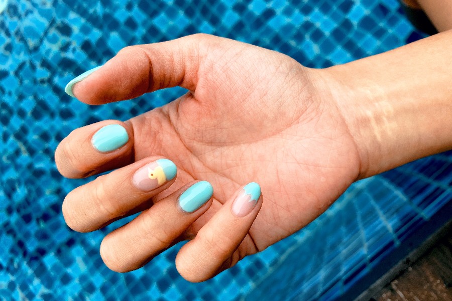 Wave tips create a dynamic, ocean-inspired twist on French nail tip design.