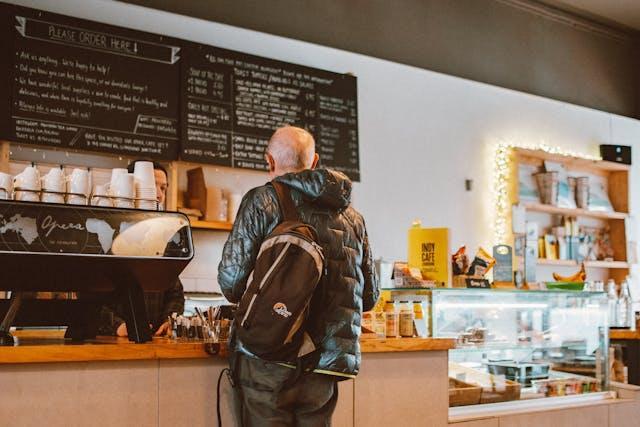 A customer talking to a person behind the counter