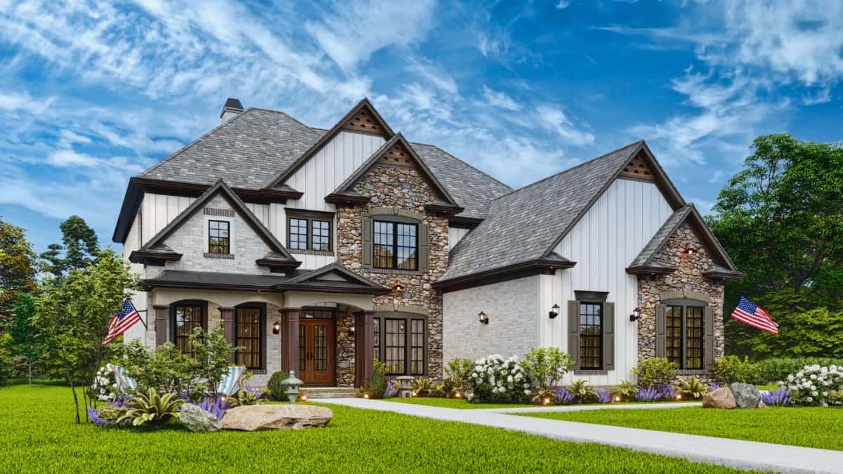 Front-left exterior view with stone and siding, multiple gables, and a covered entry porch framed with archways.