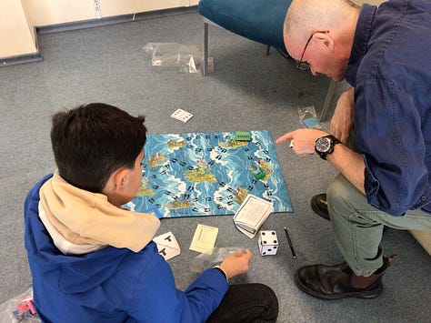 Some of the board games students created. 