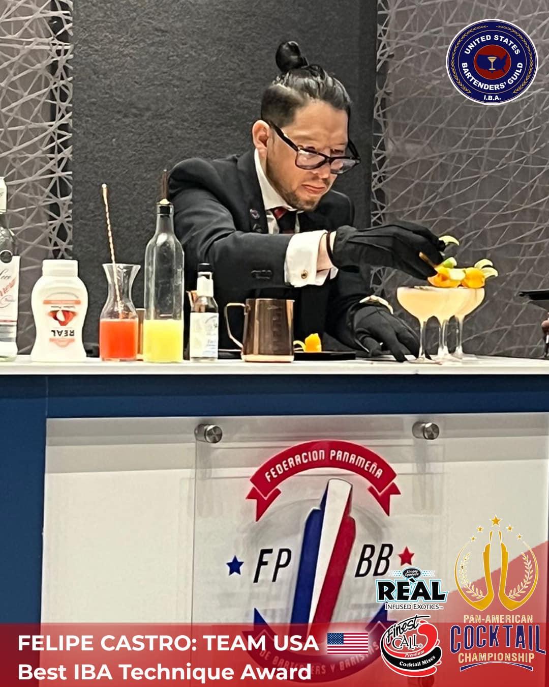 A person in a suit and gloves making a drink

Description automatically generated