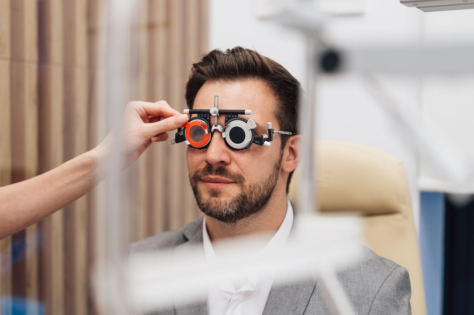 A person undergoing an annual eye exam covered under their vision insurance.