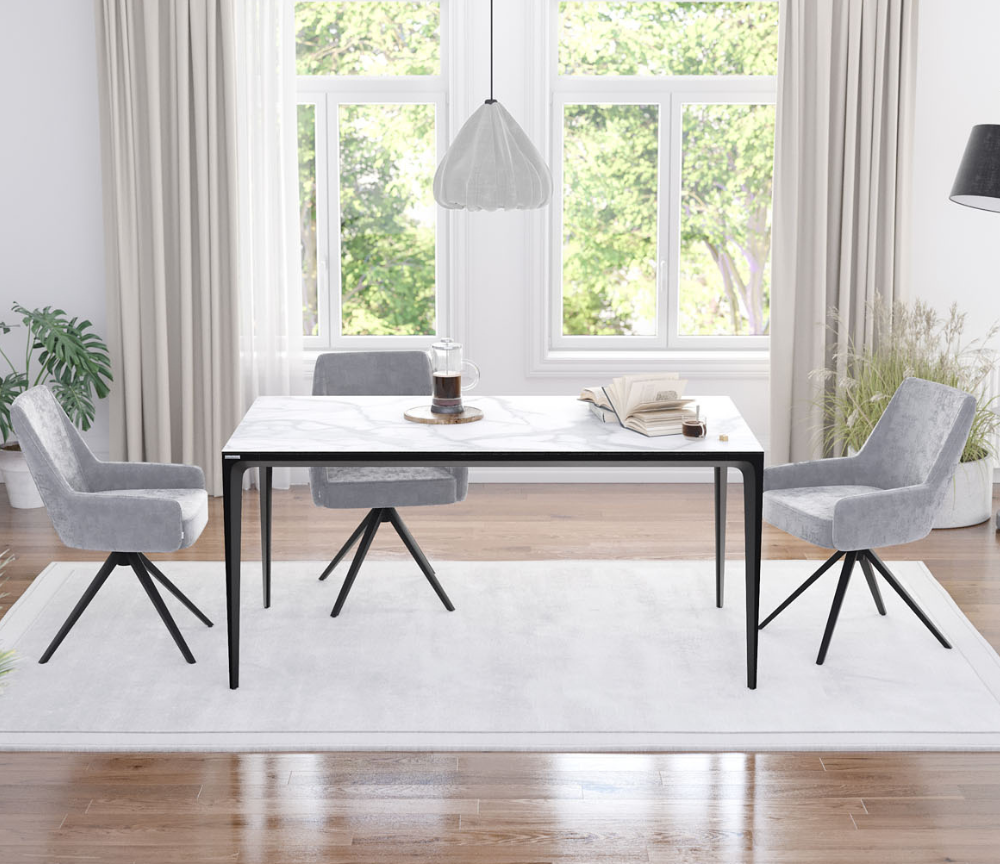 Table en céramique blanche dans une salle à manger lumineuse, illustrant parfaitement les avantages et inconvénients à connaître pour bien choisir une table en céramique design.