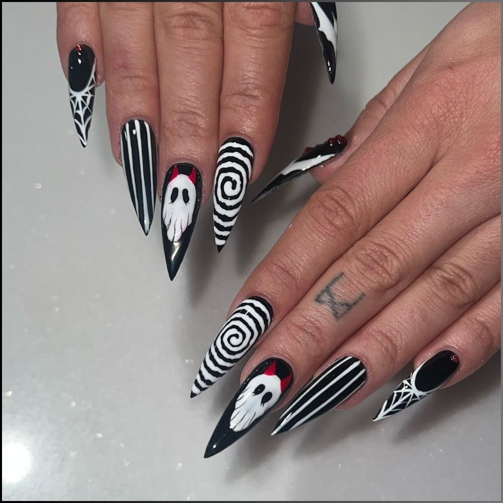 Close up of nails with spooky nails having Black and White Spooky Nails