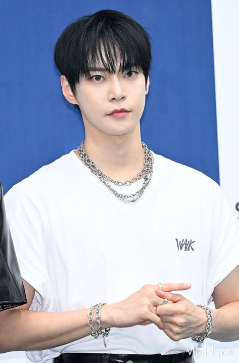 A picture of DOYOUNG wearing a white shirt 