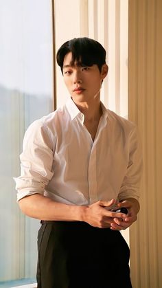 This contains an image of Ryu Jun Yeol in a white shirt and black trouser