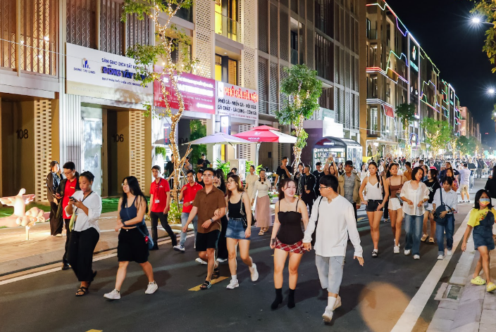 A group of people walking on a streetAI-generated content may be incorrect.