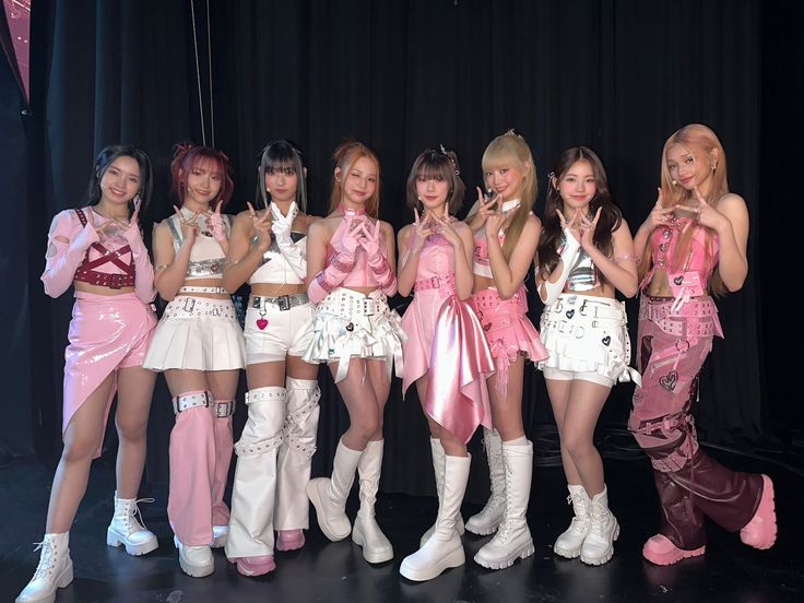 This  contain  UNi debut girls are all dressed in pink and white