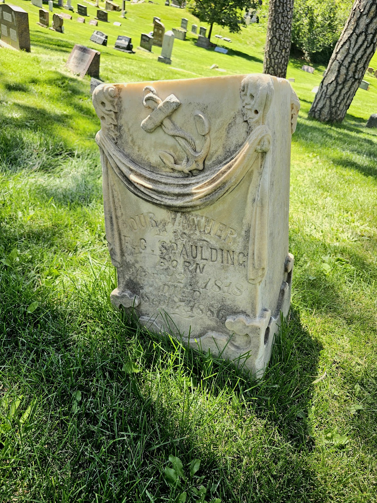 An anchor symbol on a headstone.