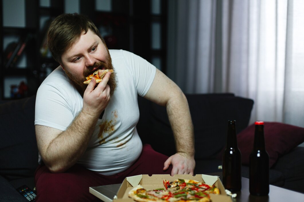 man eating pizza