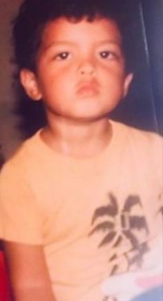 This contain an image of Bruno Mars at his early age three