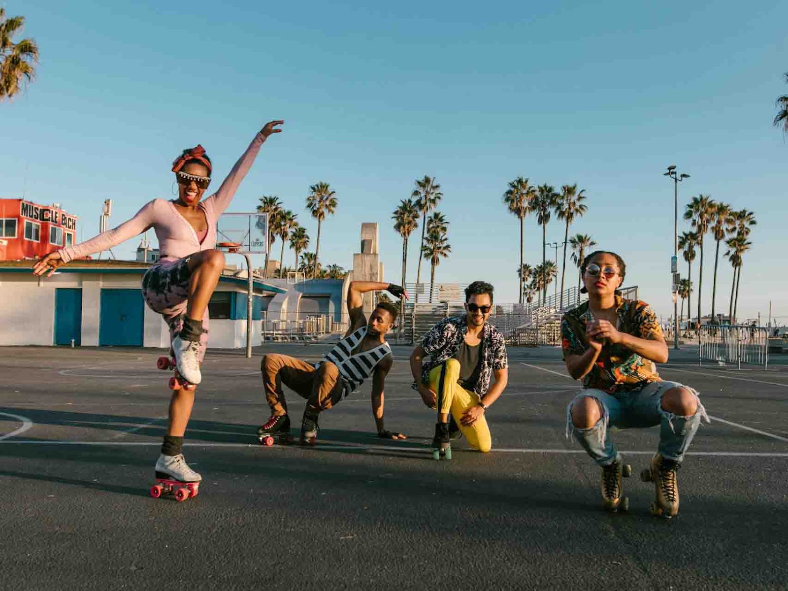 Group of friends skating under sunny skies, showcasing the benefits of skateboarding such as fitness, coordination, and social connection