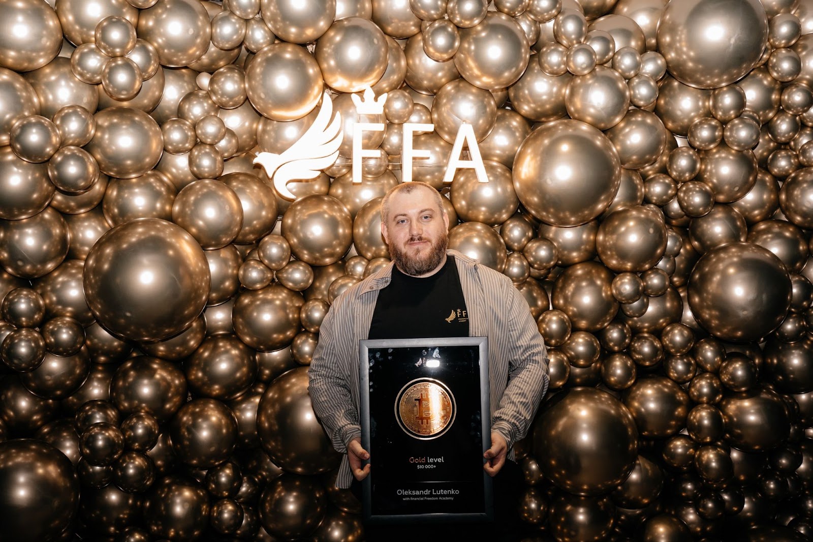 FFA Level X Club graduate receiving an award from Oleksandr Orlovskyi