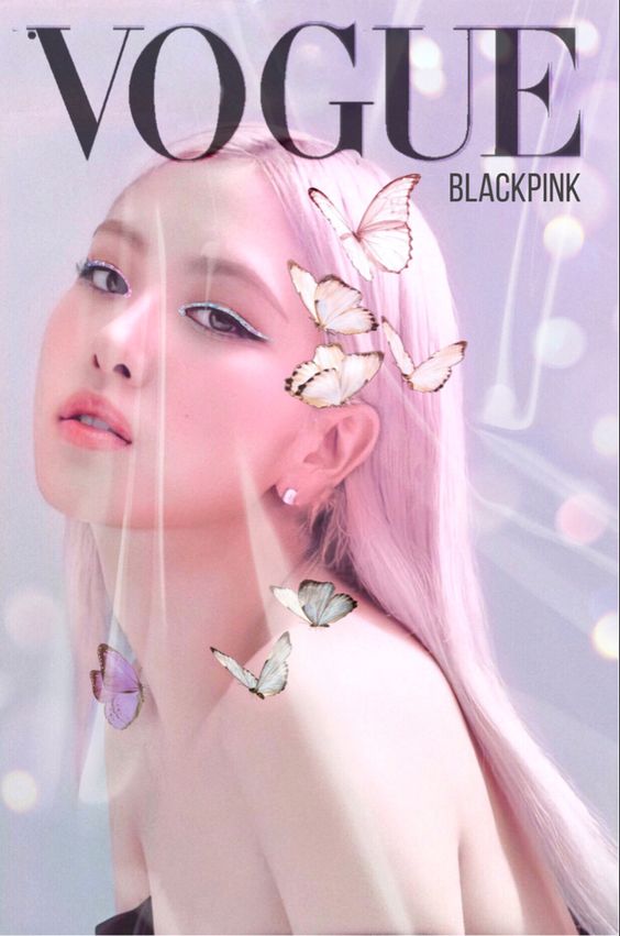 This contain:s an image of Blackpink Rosé's with a pink hair and butterfly earrings on her head, in front of a magazine cover