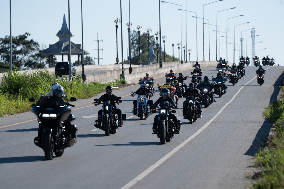 A group of people on motorcycles on a road

Description automatically generated