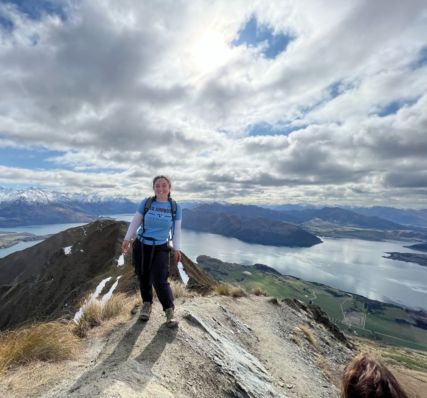 Sophie on a hike with view of water and mountains