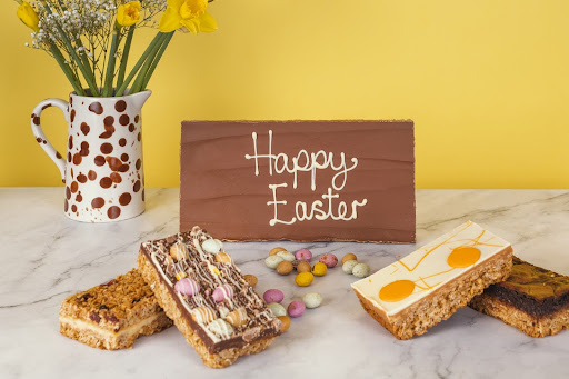happy easter flapjacks with a yellow wall and marble counter and flowers